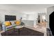 Cozy living area with soft couch, dark rug and lots of light at 9533 Silverdale Ln, Charlotte, NC 28269