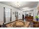 Cozy living area with hardwood floors, an area rug, large windows, and ample natural light at 9533 Silverdale Ln, Charlotte, NC 28269