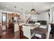 Open concept living space with a dining area, kitchen island, and comfortable seating at 9533 Silverdale Ln, Charlotte, NC 28269