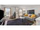 Comfortable living room with a gray couch, large windows, and a dark rug on the floor at 9533 Silverdale Ln, Charlotte, NC 28269