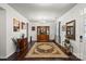 Elegant living room featuring hardwood floors, a decorative rug, and a stylish display cabinet at 9533 Silverdale Ln, Charlotte, NC 28269