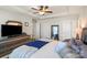 Main bedroom featuring tray ceiling, dresser, tv, and soft decor at 9533 Silverdale Ln, Charlotte, NC 28269