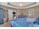Bedroom with a tray ceiling, neutral-toned walls, and doorway view to the living room at 9614 Turning Wheel Dr, Charlotte, NC 28214