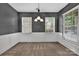 Elegant dining room features classic wainscoting, neutral paint, and ample natural light at 9614 Turning Wheel Dr, Charlotte, NC 28214