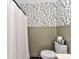 Stylish bathroom with leaf-patterned wallpaper, wainscoting, and modern fixtures at 100 Willow Run Dr # 26, Gastonia, NC 28056