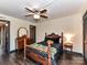 Well-lit bedroom with ceiling fan, traditional furnishings and a comfortable four poster bed at 100 Willow Run Dr # 26, Gastonia, NC 28056