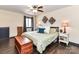 Bright bedroom boasts hardwood floors, large bed, and decorative wall art at 100 Willow Run Dr # 26, Gastonia, NC 28056