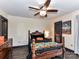 This cozy bedroom includes a four poster bed, ceiling fan, and ample natural light at 100 Willow Run Dr # 26, Gastonia, NC 28056