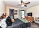 Well-appointed bedroom features ceiling fan, desk and access to outdoor balcony at 100 Willow Run Dr # 26, Gastonia, NC 28056