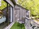 Cozy balcony with artificial turf, outdoor chair, and sliding glass door at 100 Willow Run Dr # 26, Gastonia, NC 28056