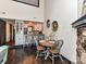 Bright dining area features a round wood table, four chairs, and is adjacent to the kitchen breakfast bar at 100 Willow Run Dr # 26, Gastonia, NC 28056