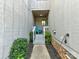 Inviting walkway to the front door with stylish outdoor decor and fresh landscaping at 100 Willow Run Dr # 26, Gastonia, NC 28056