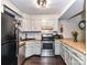 Well-lit kitchen featuring wood countertops, stainless steel appliances, and white subway tile backsplash at 100 Willow Run Dr # 26, Gastonia, NC 28056