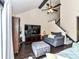 Relaxing living room boasts a large television, comfortable seating, and a stairway at 100 Willow Run Dr # 26, Gastonia, NC 28056