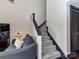Cozy living room featuring a staircase, comfortable seating, and warm lighting at 100 Willow Run Dr # 26, Gastonia, NC 28056