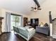 Open living room includes ceiling fan, and sliding glass doors to the outdoor space at 100 Willow Run Dr # 26, Gastonia, NC 28056