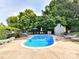 Enjoy this pristine community pool featuring lounge chairs, shade umbrellas, and a secure gated area at 100 Willow Run Dr # 26, Gastonia, NC 28056