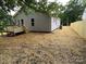 Backyard view showing new fence and side of house with siding at 1024 Short St, Salisbury, NC 28144