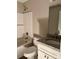Cozy bathroom featuring a shower, toilet, and vanity with a gray granite countertop at 1024 Short St, Salisbury, NC 28144