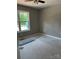 Bright bedroom with a large window offering an abundance of natural light and a ceiling fan at 1024 Short St, Salisbury, NC 28144