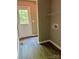 Functional laundry room with hookups, vinyl flooring, and natural light at 1024 Short St, Salisbury, NC 28144