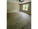 Inviting living room with durable flooring, ample natural light, and a ceiling fan at 1024 Short St, Salisbury, NC 28144
