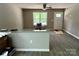 Bright living area with sleek flooring, gray walls, and a view of the outdoors through a large window at 1024 Short St, Salisbury, NC 28144