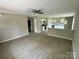 Living room featuring an open layout and new flooring and leading to the kitchen at 1024 Short St, Salisbury, NC 28144