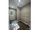 Bright mud room with a utility sink, access to the backyard, and vinyl flooring at 1024 Short St, Salisbury, NC 28144
