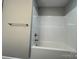 Clean shower and tub combo, featuring brushed nickel hardware, with an updated white surround at 1024 Short St, Salisbury, NC 28144