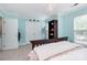 Bedroom features closet, bookshelf, blue walls and a chandelier for lighting at 10378 Alexander Martin Ave, Charlotte, NC 28277