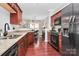 Spacious kitchen boasting granite countertops, stainless steel appliances, and ample cabinet space at 10378 Alexander Martin Ave, Charlotte, NC 28277