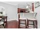 View of the kitchen with barstool seating that is adjacent to the dining room at 10378 Alexander Martin Ave, Charlotte, NC 28277