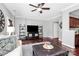 Cozy living room featuring a large TV, comfortable seating, and hardwood floors at 10378 Alexander Martin Ave, Charlotte, NC 28277
