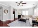 Spacious living room with hardwood floors, neutral paint, and stylish decor for a welcoming ambiance at 10378 Alexander Martin Ave, Charlotte, NC 28277