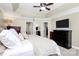 Spacious main bedroom featuring tray ceiling, neutral tones, and adjacent ensuite bathroom and closet at 10378 Alexander Martin Ave, Charlotte, NC 28277
