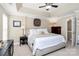 Relaxing main bedroom with tray ceiling, neutral tones, plush carpet and ample natural light at 10378 Alexander Martin Ave, Charlotte, NC 28277