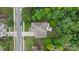 Stunning aerial view of a well-maintained property with a large backyard and patio area surrounded by lush greenery at 1104 Snowbird Ln, Waxhaw, NC 28173