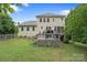 Well-maintained backyard offers a spacious deck with seating, perfect for outdoor relaxation and entertaining at 1104 Snowbird Ln, Waxhaw, NC 28173