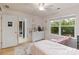 This bedroom features a view to the backyard, and access to the bathroom and closet at 1104 Snowbird Ln, Waxhaw, NC 28173