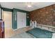 Spacious bedroom with green walls and a book-themed accent wall at 1104 Snowbird Ln, Waxhaw, NC 28173