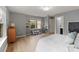 Neutral bedroom with light wood floors, natural light, and built-in shelving at 1104 Snowbird Ln, Waxhaw, NC 28173