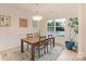 Well-lit dining room with a wooden table and decorative chandelier fixture at 1104 Snowbird Ln, Waxhaw, NC 28173
