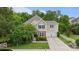 Charming two-story home with stone accents, manicured lawn, two-car garage, and lush landscaping at 1104 Snowbird Ln, Waxhaw, NC 28173