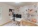 Lovely home office featuring a custom rose wallpaper and an adjustable-height desk at 1104 Snowbird Ln, Waxhaw, NC 28173