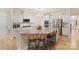 Spacious kitchen featuring white cabinets, granite counters and modern lighting at 1104 Snowbird Ln, Waxhaw, NC 28173