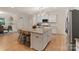 Open-concept kitchen with granite countertops and stainless steel appliances at 1104 Snowbird Ln, Waxhaw, NC 28173