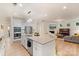 Bright kitchen with granite countertops, stainless steel appliances, and an island with seating at 1104 Snowbird Ln, Waxhaw, NC 28173