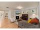 Bright living room featuring a cozy fireplace and ample seating at 1104 Snowbird Ln, Waxhaw, NC 28173