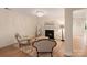 Cozy sitting area with a fireplace, chandelier, and stylish seating, creating a warm and inviting space at 1104 Snowbird Ln, Waxhaw, NC 28173